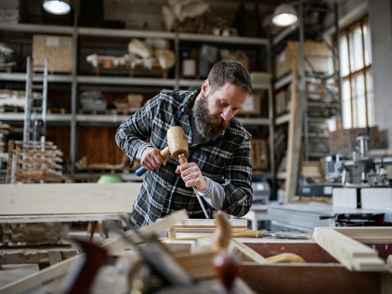 Craftsperson working by hand at a joinery bench