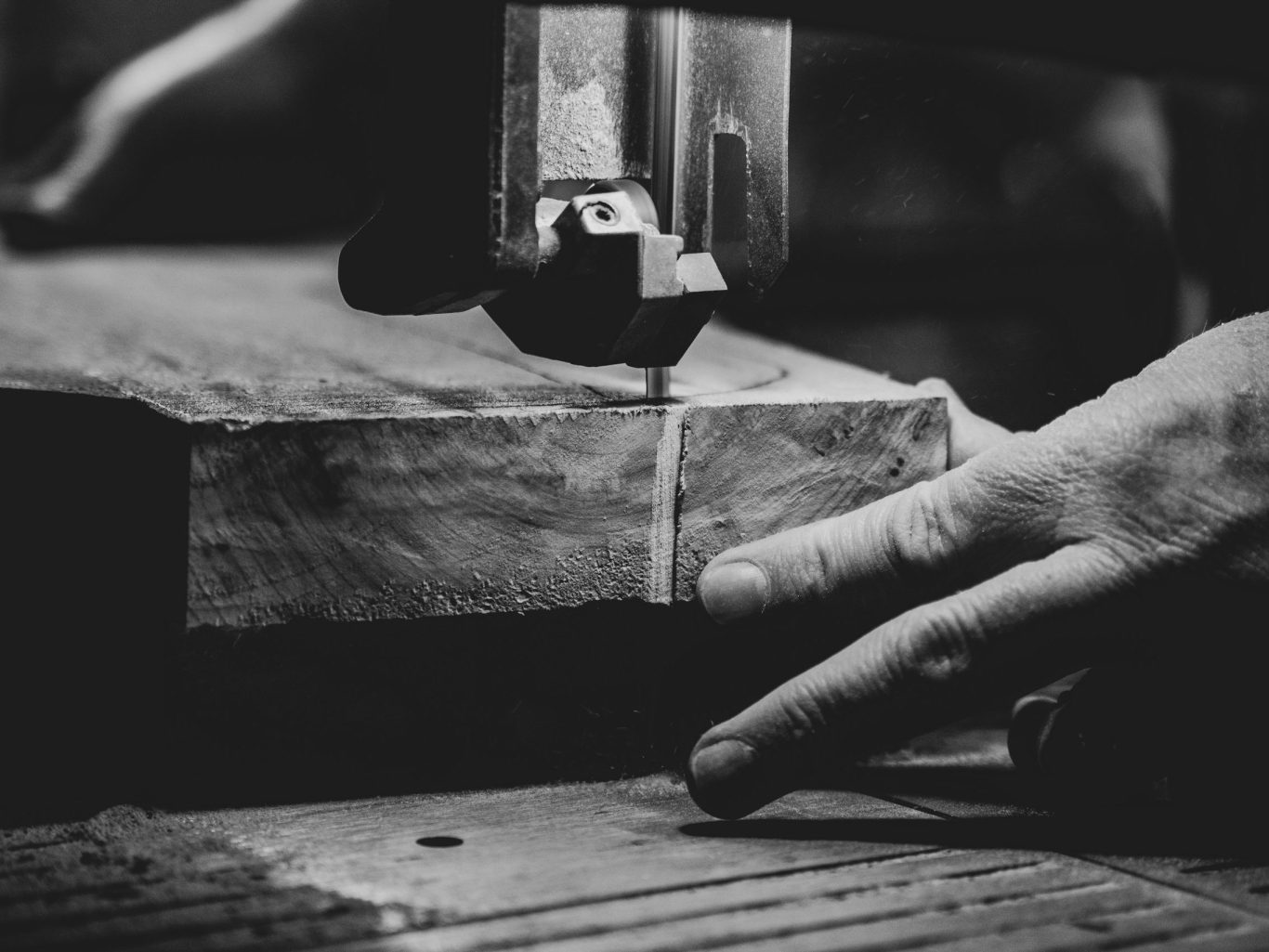 Timber being carefully shaped on workshop machinery